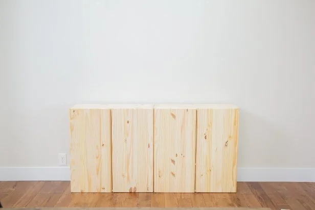 The next step in this DIY bold bar project is to choose your furniture pieces to use as the bar itself. Here, we used two unfinished cabinets.